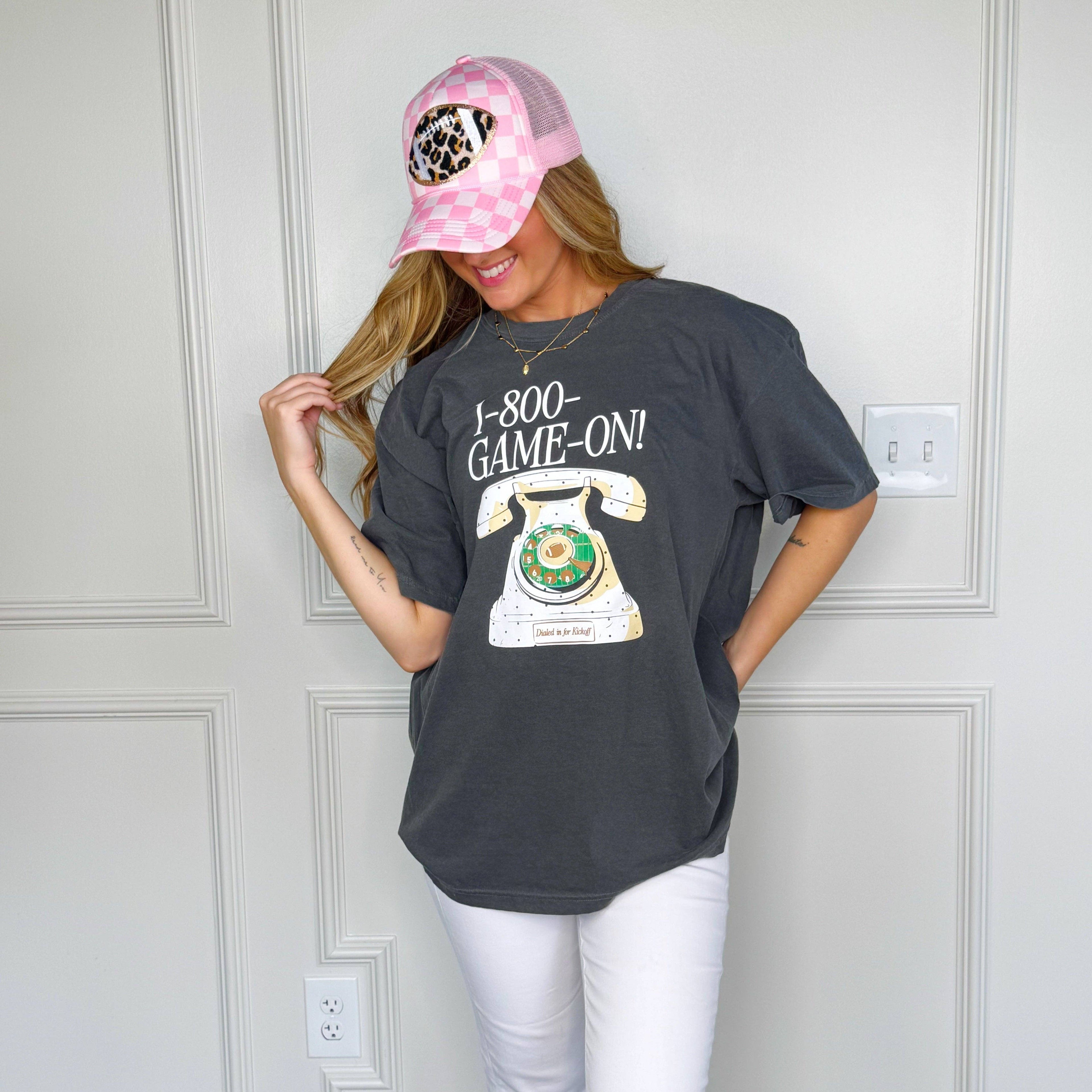 Women's dark gray Comfort Colors 1-800-GAME-ON football graphic tee for fall game days, tailgate parties, and casual football season outfits.
