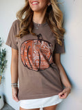 Espresso Comfort Colors shirt with orange bandana pumpkin.