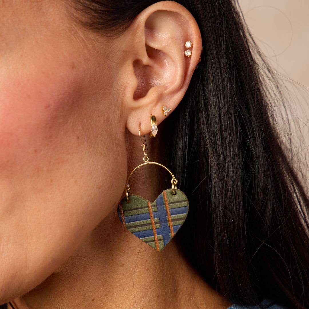 Close-up of Basil green tartan leather heart earrings with a classic plaid pattern.