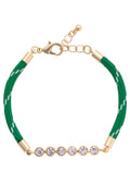 Green bracelet with gold accents and crystal beads on a white background