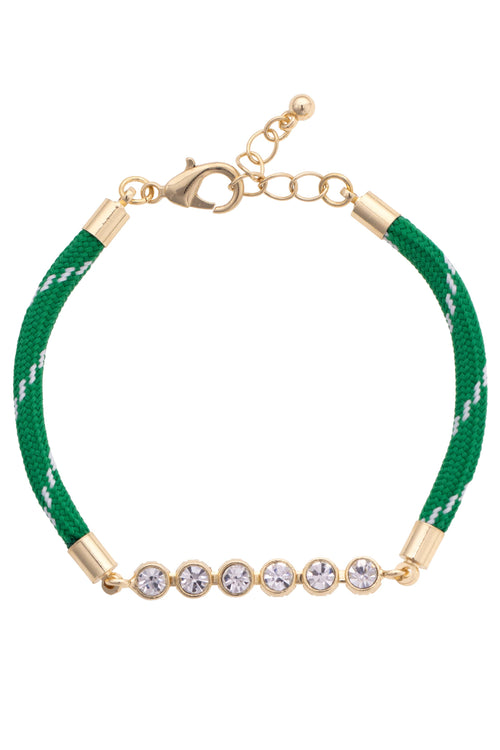 Green bracelet with gold accents and crystal beads on a white background