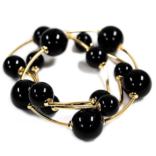 Black ball stretch bracelets set of 2 with gold bead accents.