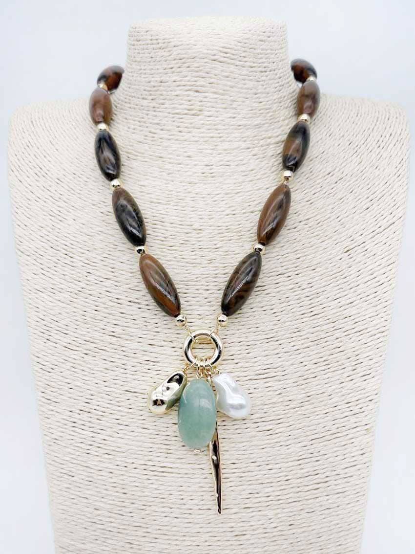 Brown natural stone necklace with pearl and green stone charms.