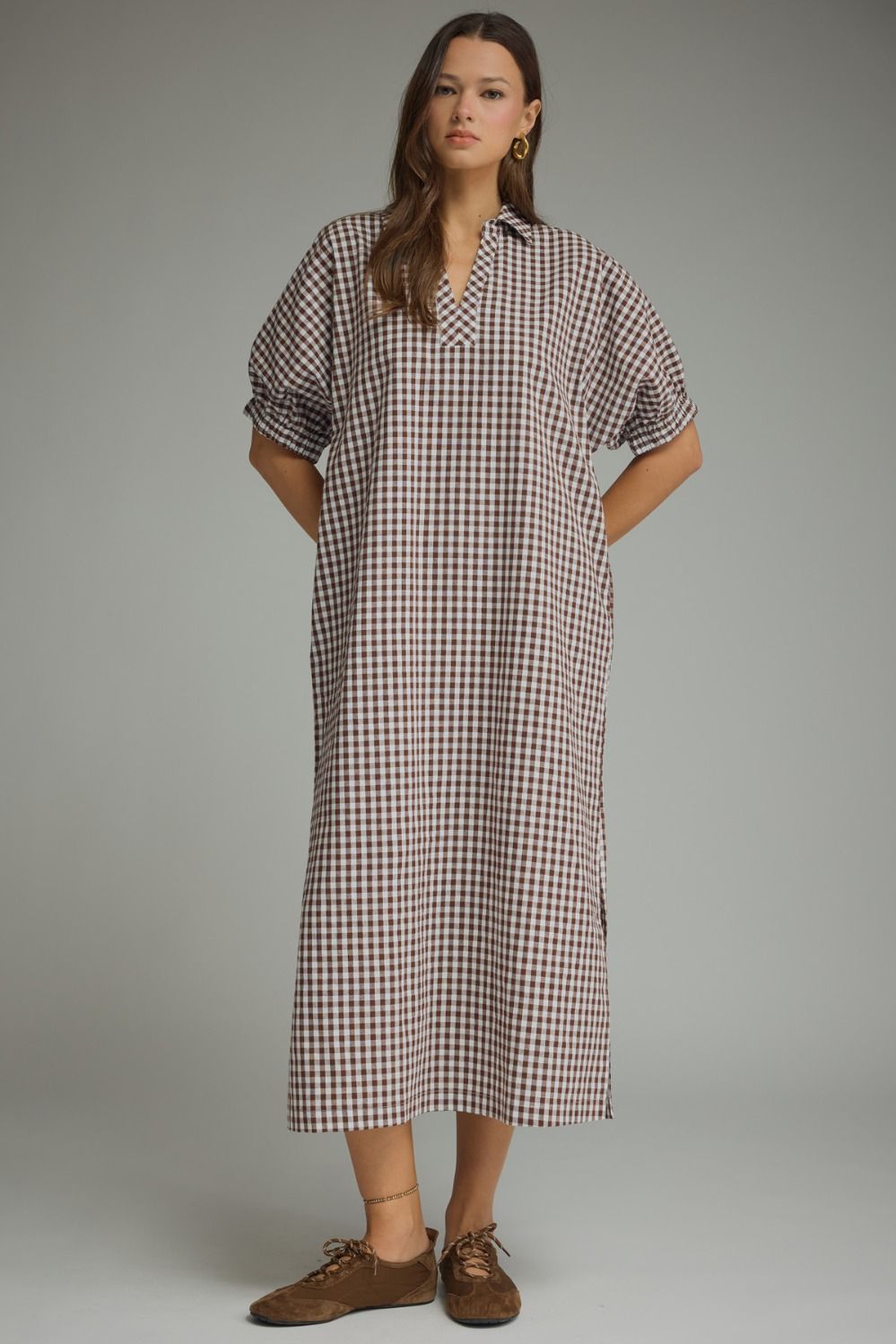 Gingham collared V-neck midi dress with short puff sleeves, side pockets, and a lightweight woven design.