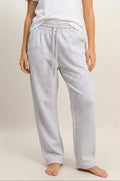Women's heather gray drawstring waist barrel sweatpants with relaxed fit, elastic waistband, and functional side pockets.
