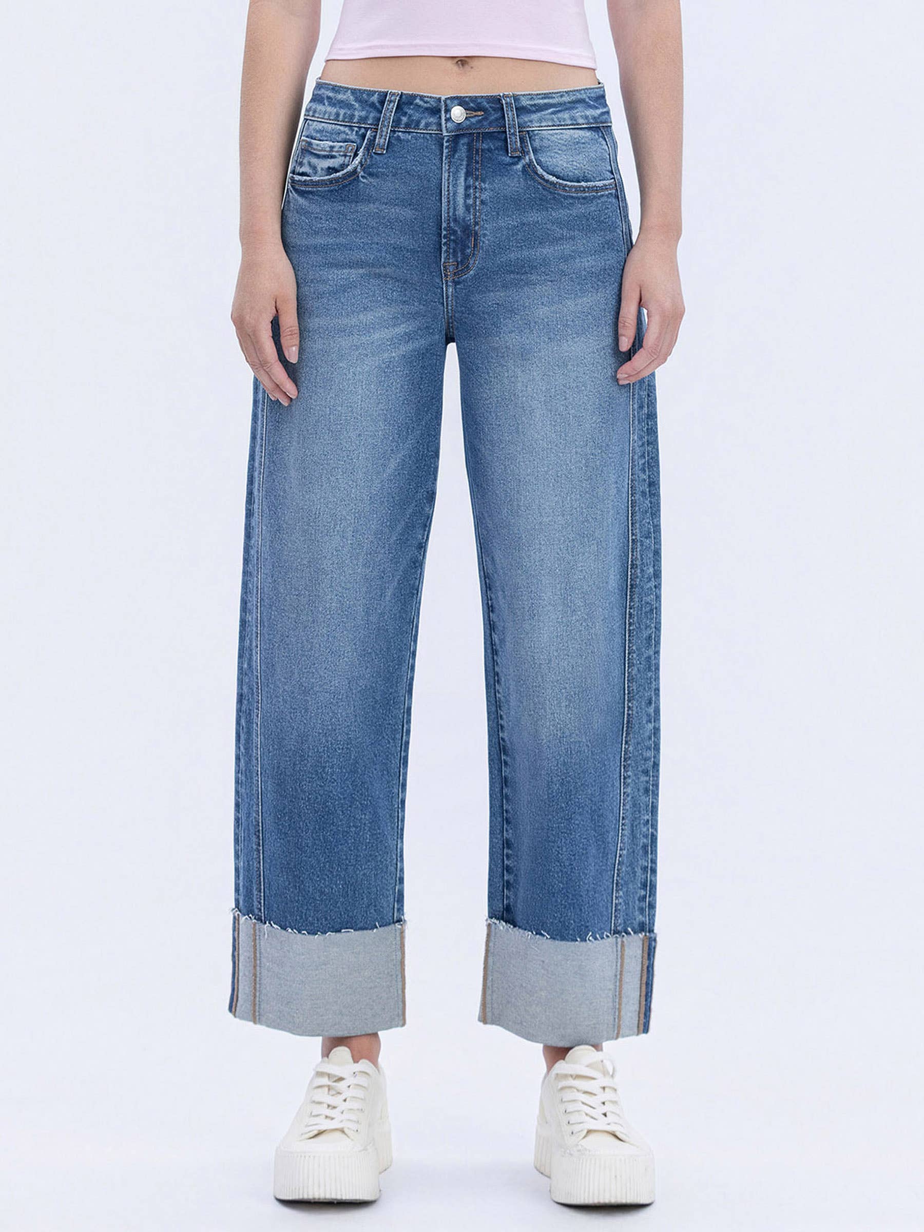 Women's high-rise cuffed barrel leg jeans in a medium wash featuring comfort stretch denim and a cropped length.