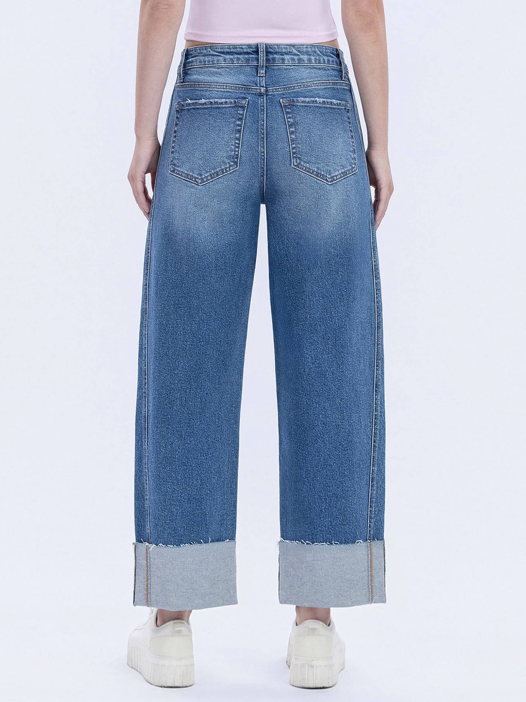 Back view of women's high-rise barrel leg jeans featuring a flattering fit and classic five-pocket styling.