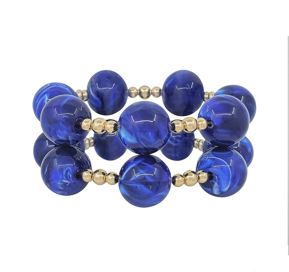 Royal blue stretch bracelets set of 2 with 20MM beads and gold accents.