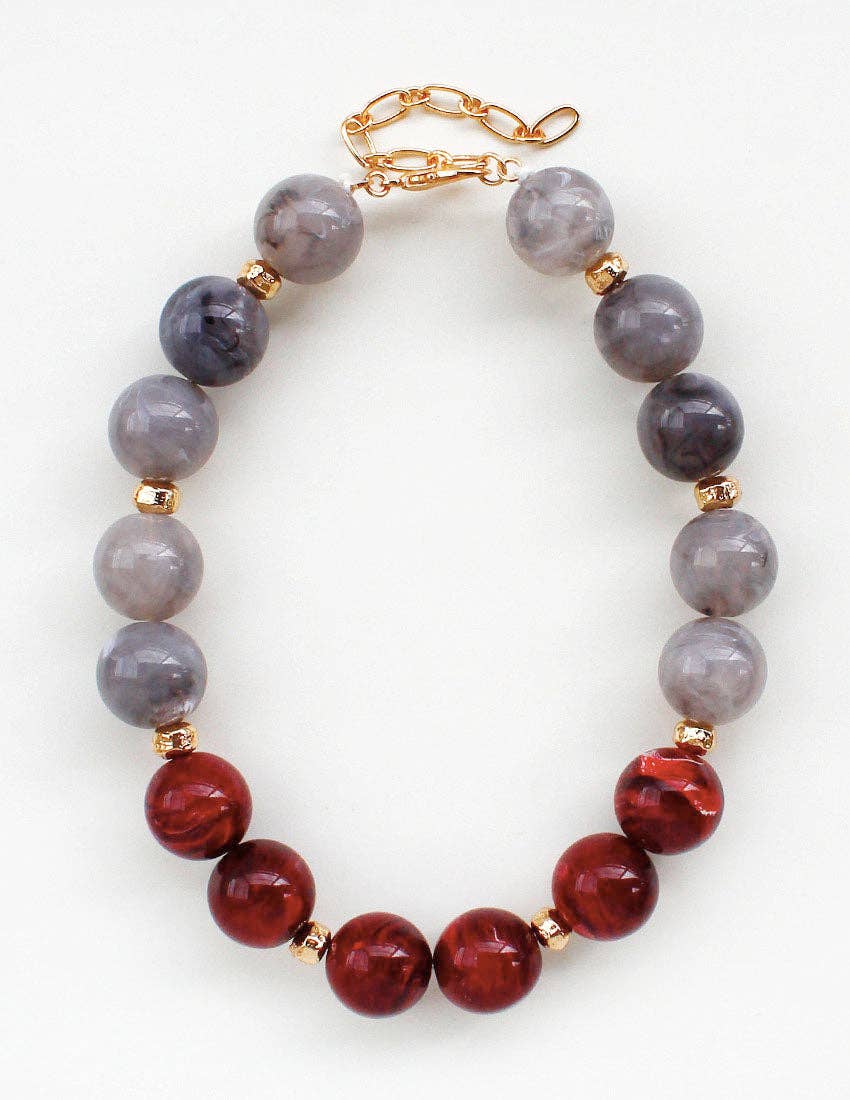 Large maroon and light grey natural stone statement necklace.
