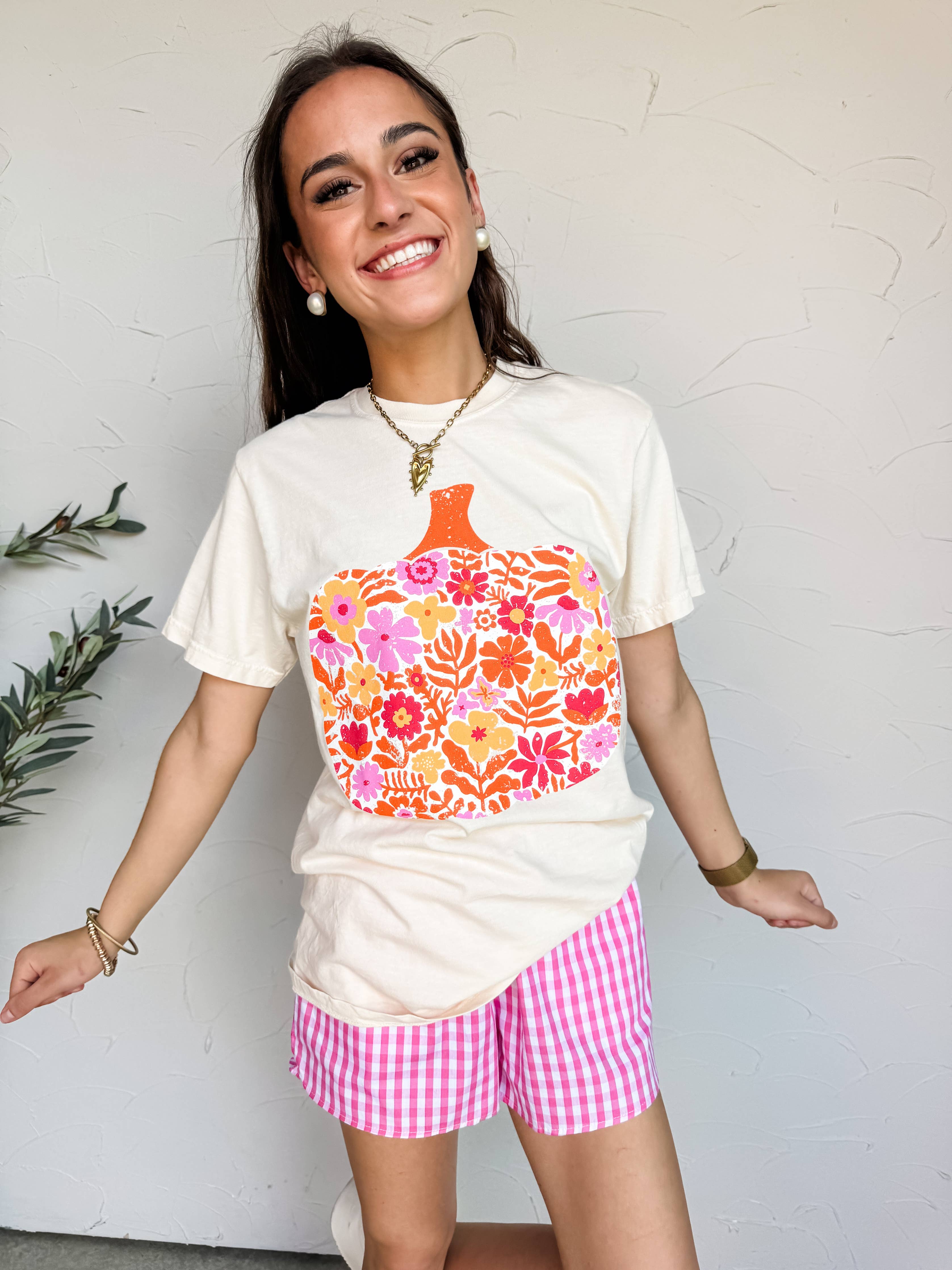 Ivory Comfort Colors shirt with pink orange and red floral pumpkin design.