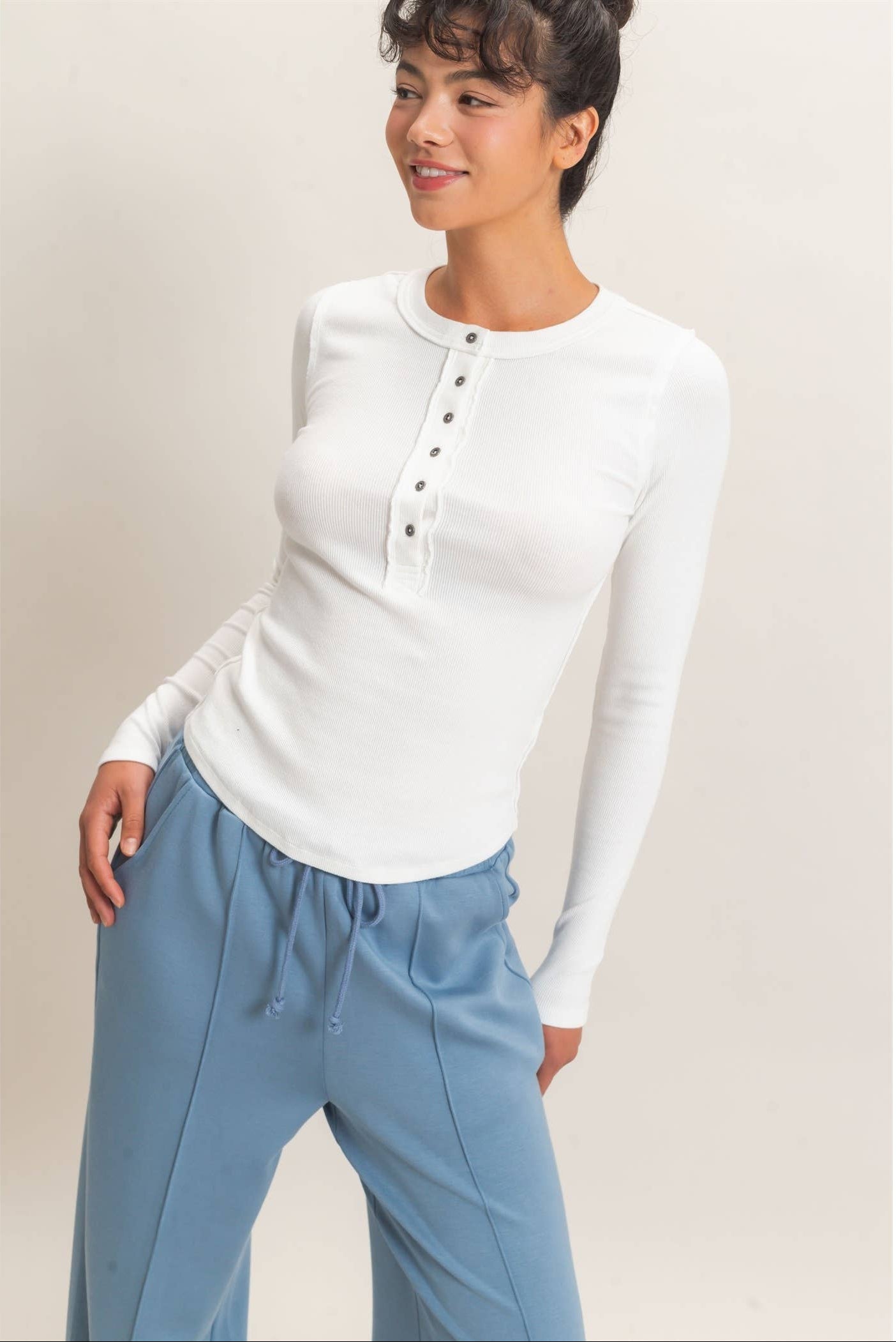 Pigment Dyed Henley Long Sleeve Top with a classic button Henley neckline and flattering fitted silhouette.