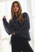 Plus size striped chiffon blouse with tie-front neckline and voluminous sleeves.