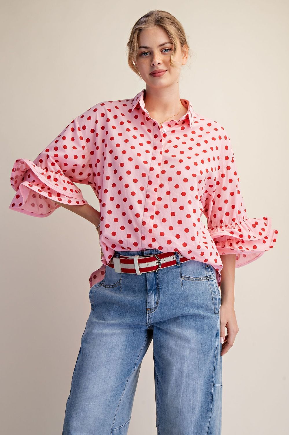 Close-up of the Polka Dot Poplin Button Down Top showing the classic polka dot print, button-down front, and collared neckline.