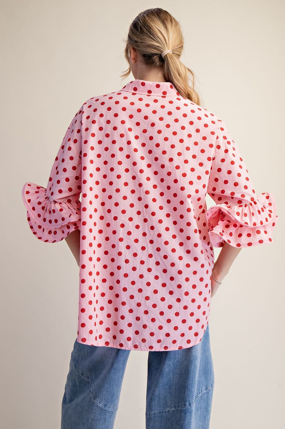 Back view of the Polka Dot Poplin Button Down Top with a longer back hem and relaxed silhouette.