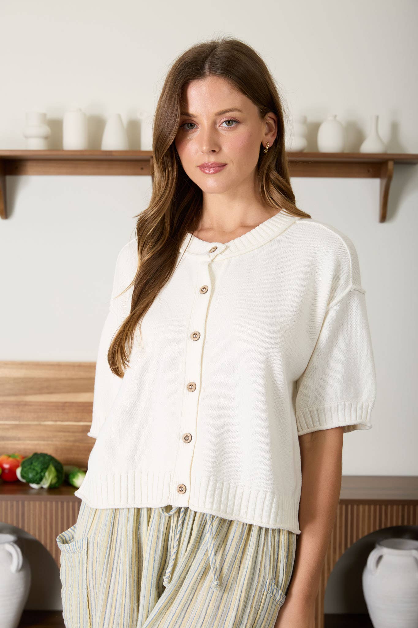 Raw Edge Detail Short Sleeve Knit Cardigan with button-down front and round neckline.