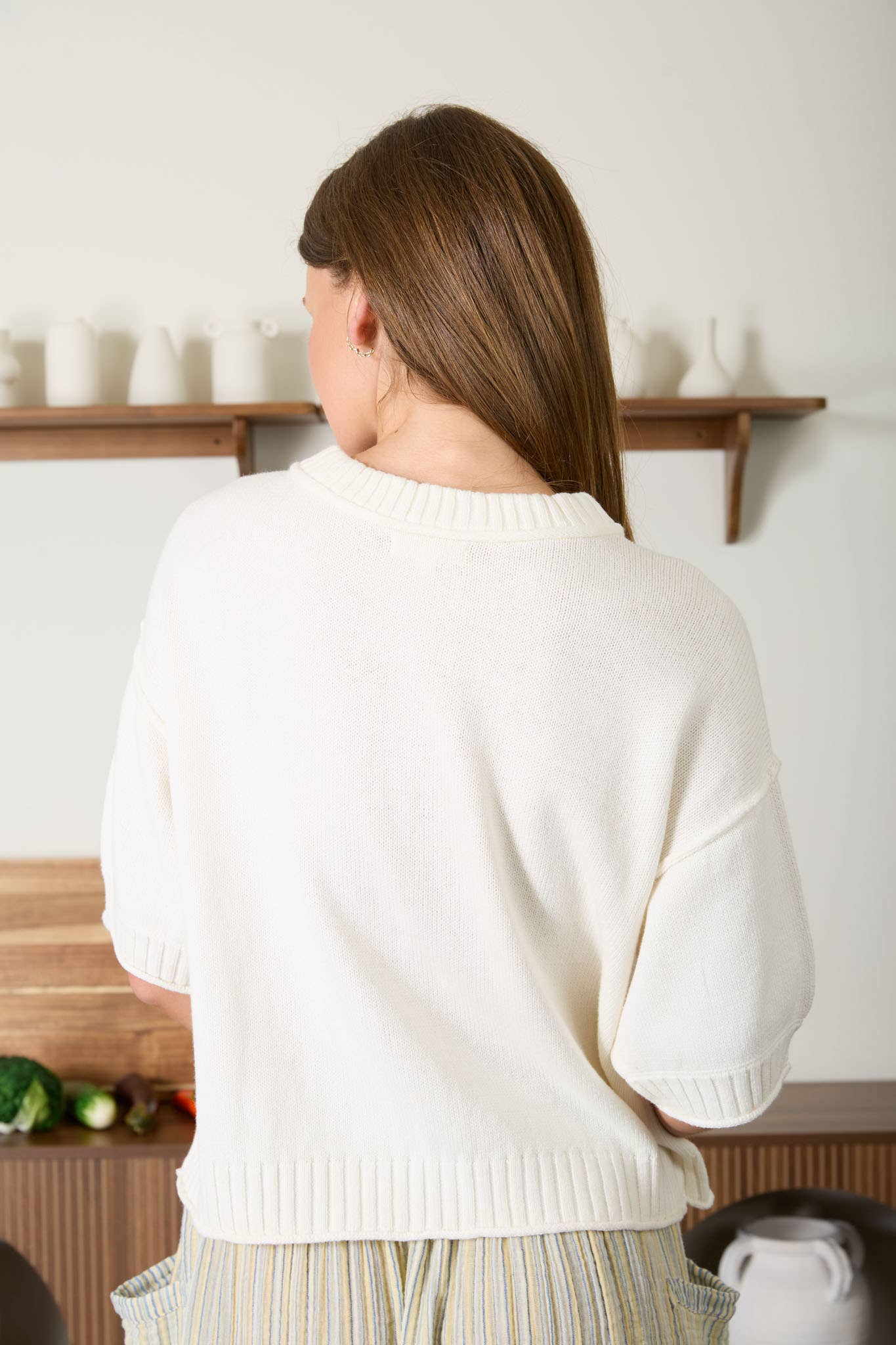 Back view of the Raw Edge Detail Short Sleeve Knit Cardigan.
