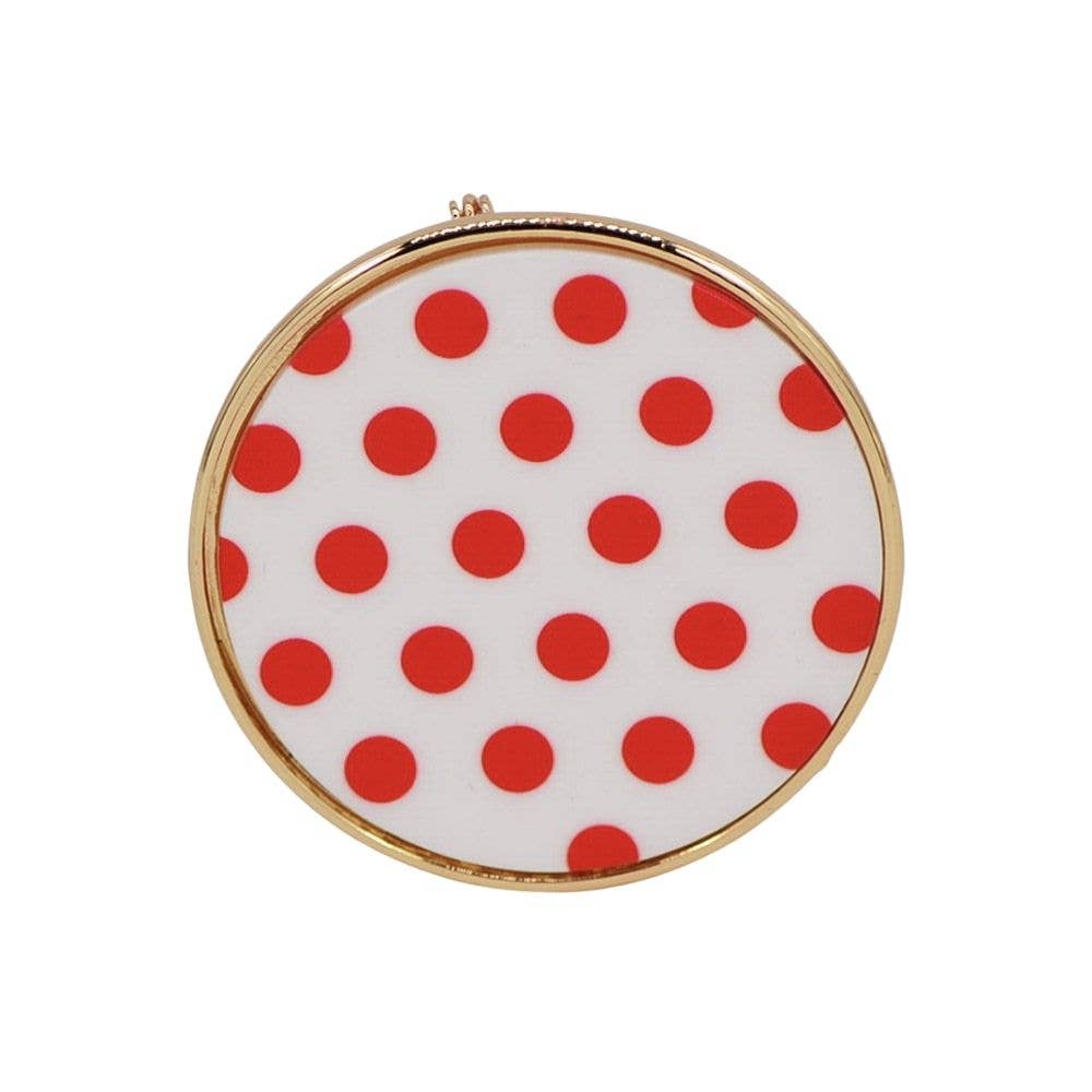 Red and white polka dot brooch with a playful vintage-inspired design.