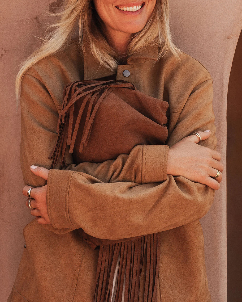 Close-up of faux suede tassel fringe on the Reese bag