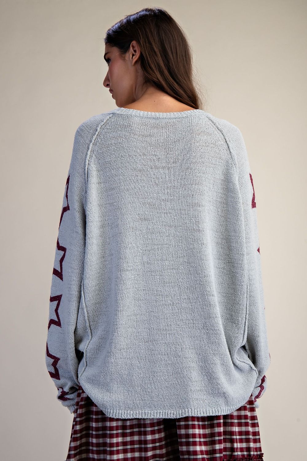 Back of relaxed fit star sweater for women