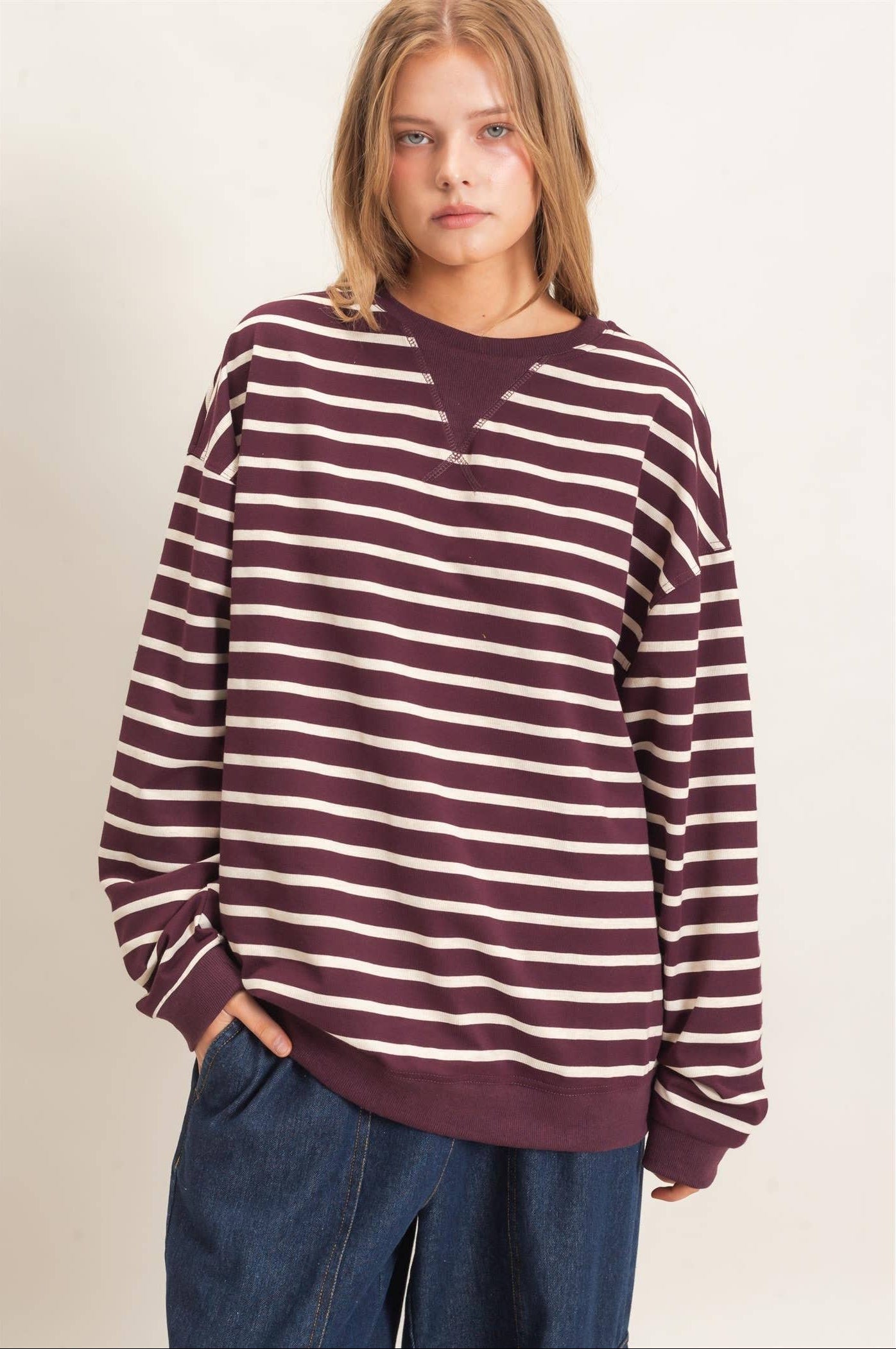 Women's burgundy and white striped long sleeve pullover with relaxed fit and ribbed cuffs.