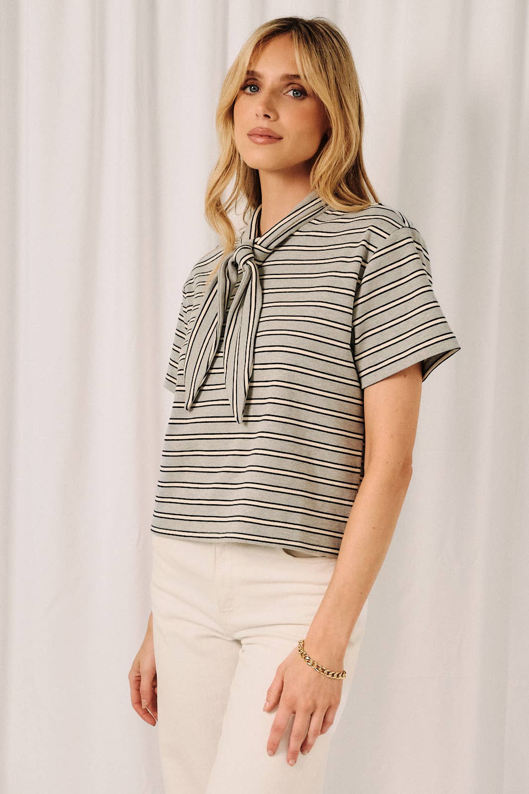 Front view of gray navy white striped blouse with scarf collar detail for a polished everyday look.