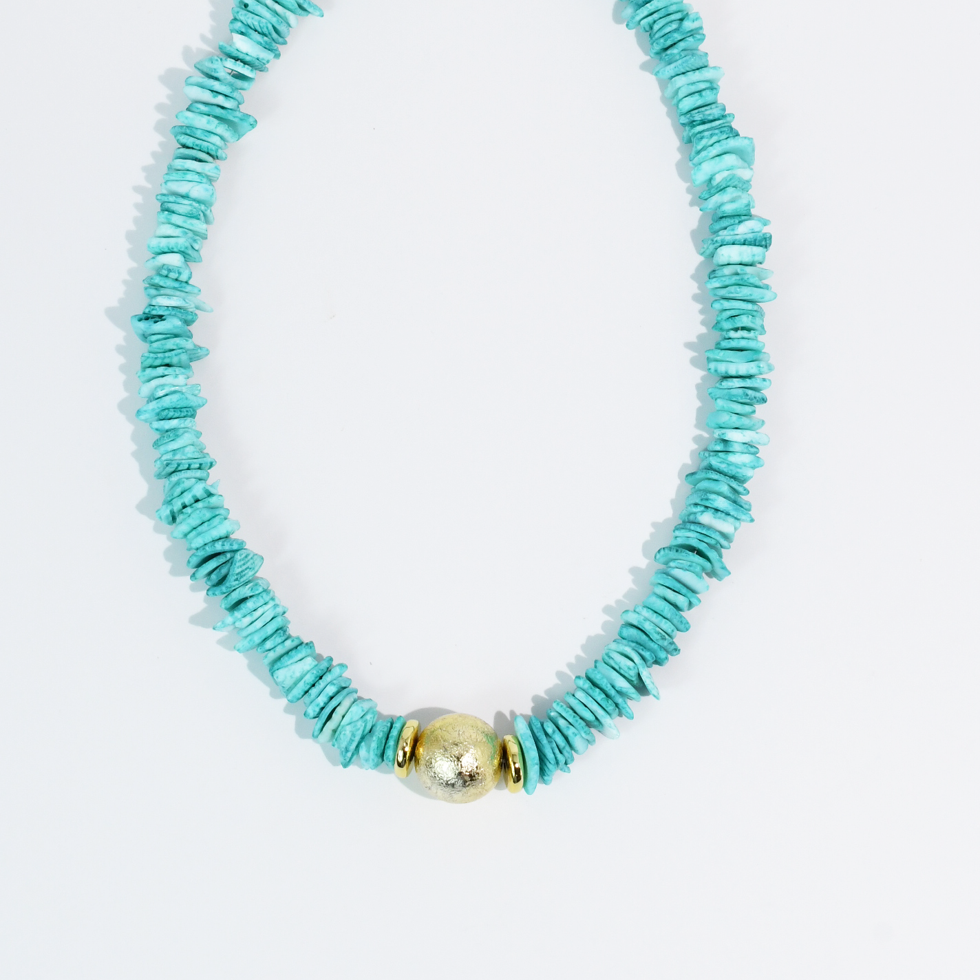 Turquoise beaded necklace with a gold clasp on a white background